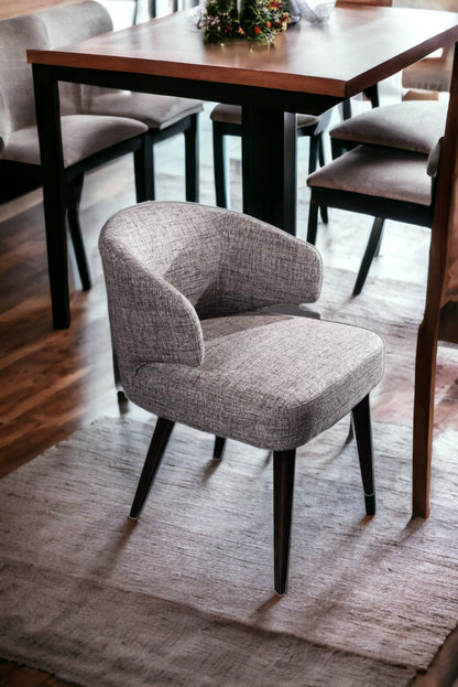 Chaise de salle à manger à dossier à oreilles en tissu rembourré gris et noir