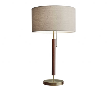 26" Antiqued Brass Solid Wood Table Lamp With Beige Drum Shade