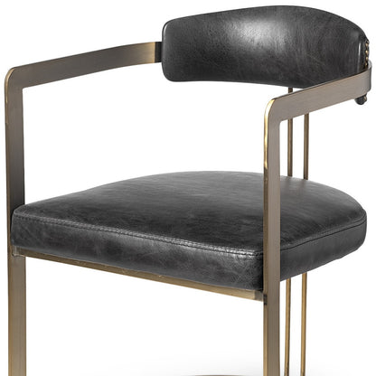 Chaise de salle à manger à dossier ouvert en cuir rembourré noir et doré