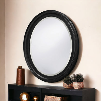 Miroir ovale avec cadre en bois noir