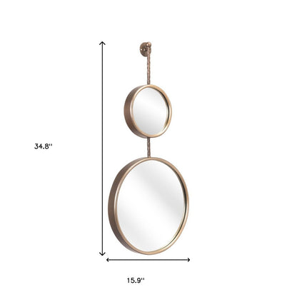 Miroir d'appoint rond encadré en acier doré de 35 po