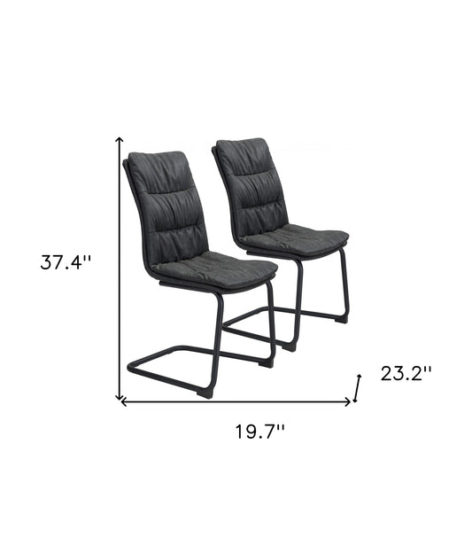 Ensemble de deux chaises de salle à manger capitonnées en similicuir noir