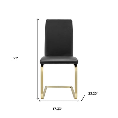 Ensemble de deux chaises de salle à manger noires et dorées Mod