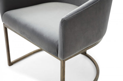 Chaise de salle à manger rembourrée en velours gris et laiton