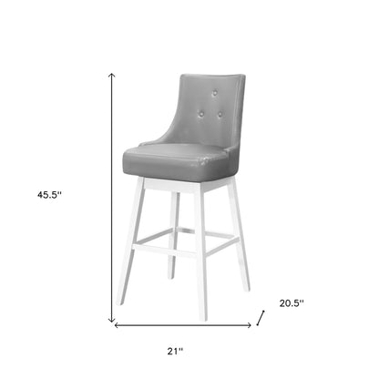 Ensemble de deux chaises de bar pivotantes en similicuir gris et blanc et en bois massif de 29 po