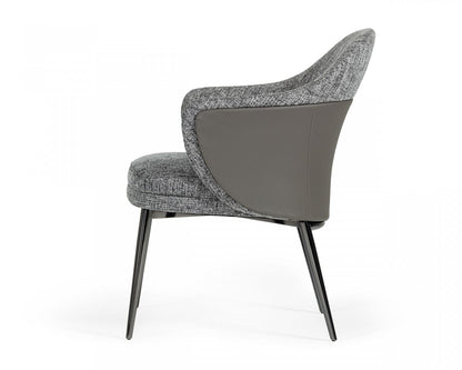 Chaise de salle à manger à dossier à oreilles en tissu rembourré gris et noir et similicuir