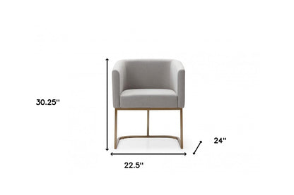 Chaise de salle à manger en tissu rembourré gris clair et laiton vieilli