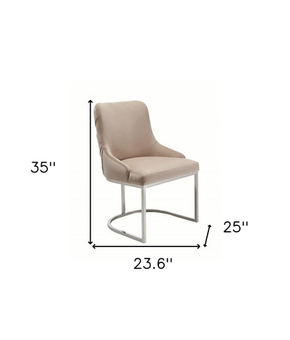 Ensemble de deux chaises de salle à manger capitonnées en velours beige et argent