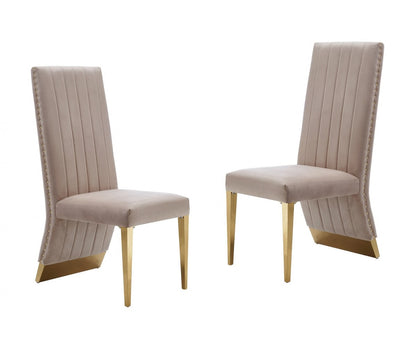 Ensemble de deux chaises de salle à manger capitonnées en velours beige et doré