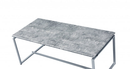 47" Silver And Faux Concrete Pvc Veneer Rectangular Coffee Table