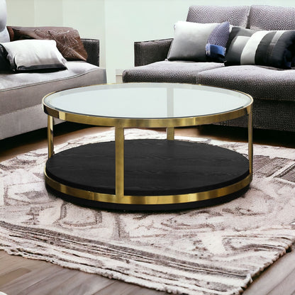 Table basse ronde en verre et métal noir et doré de 44 po avec étagère