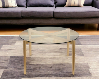 Table basse ronde en verre et acier transparent et doré de 36 po