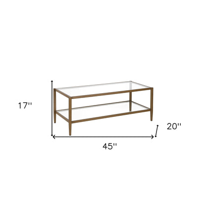 Table basse en verre et métal transparent et laiton vieilli de 45 po avec étagère