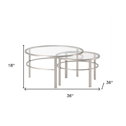 Ensemble de deux tables basses rondes gigognes en verre transparent et argenté et en acier de 36 po