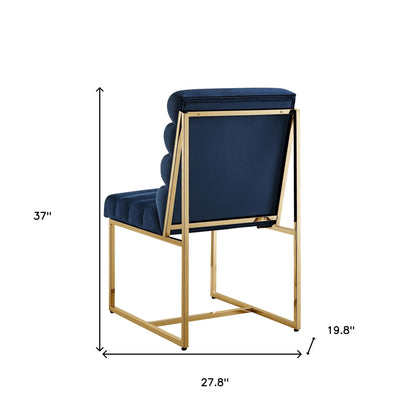 Ensemble de deux chaises de salle à manger capitonnées en velours bleu marine et doré