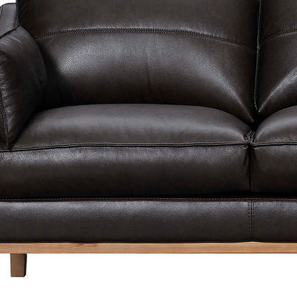 87" Dark Brown Leather Sofa And Toss Pillows With Brown Legs