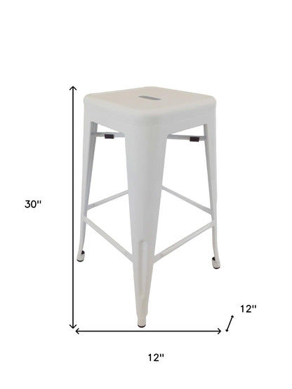 Ensemble de quatre chaises de bar sans dossier en métal blanc de 30 po